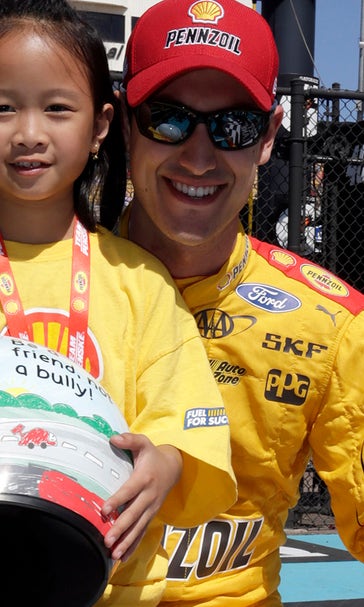 With special helmet, Joey Logano promotes anti-bullying